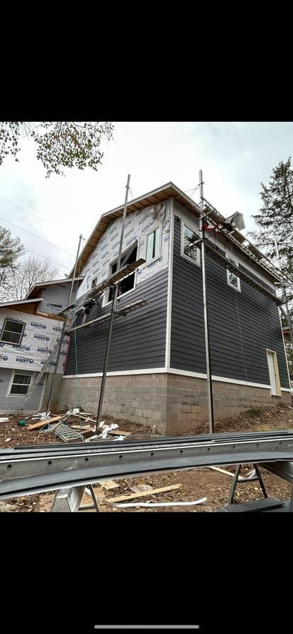 Installing vinyl siding on a home